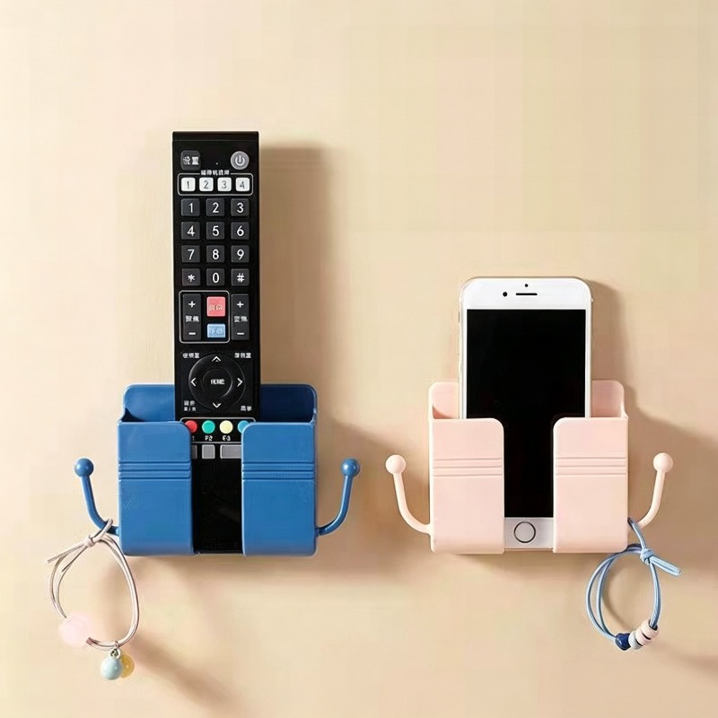 Drill Bits - 壁に穴を開けずに設置できる、多色のリモコン収納ラック。スマートフォン充電スタンドとしても使用でき、側面にフックが付いています。ご家庭での使用に最適。